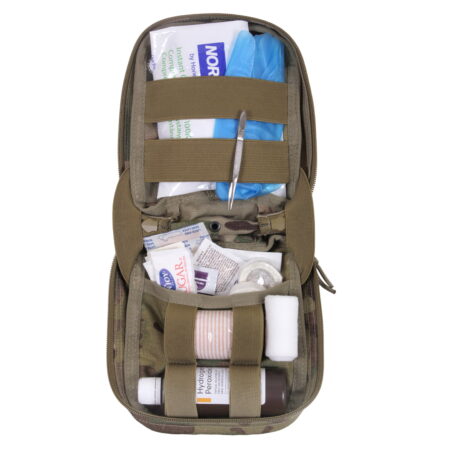 Open MOLLE MultiCam first aid kit containing various medical supplies and tools.