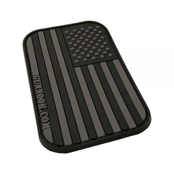 Black rubber patch featuring a stylized American flag with raised stars and stripes.