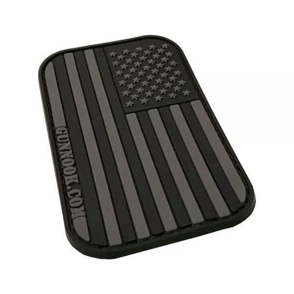 Black rubber patch featuring a stylized American flag with raised stars and stripes.